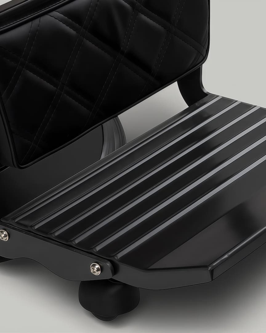 Sillón peluquero negro Carlos Gabbiano reposapiés