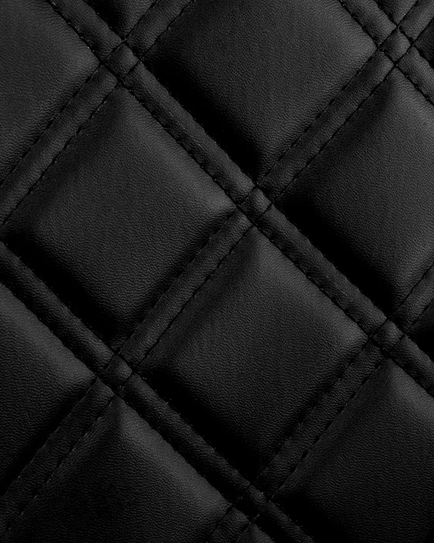 Sillón peluquero negro Carlos Gabbiano textura tapicería